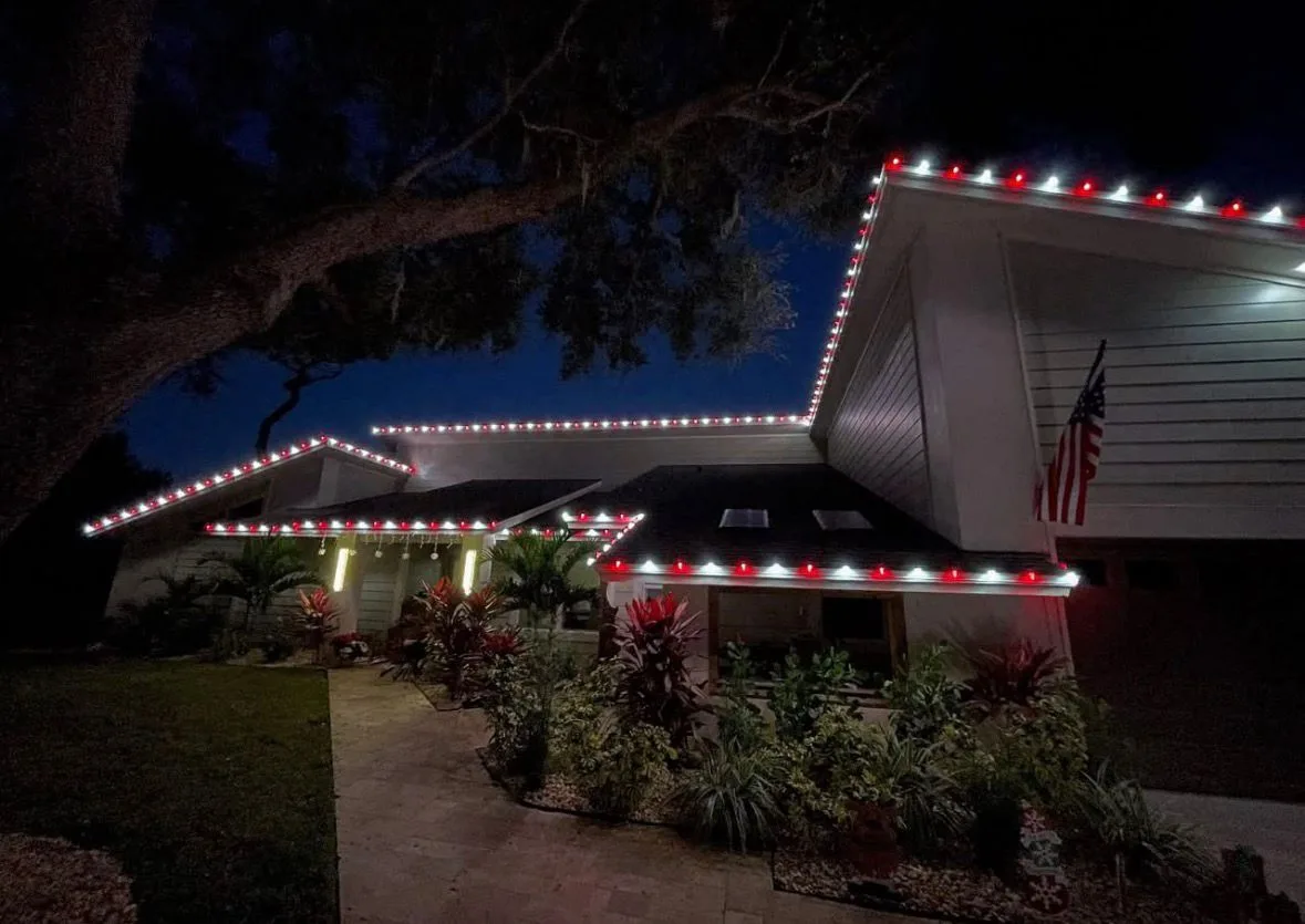 Mid-century home in South Tampa, FL with red and white roofline Christmas lighting