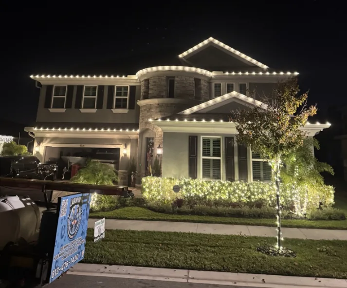 Two-story estate home in Wesley Chapel, FL with warm white roofline Christmas lighting